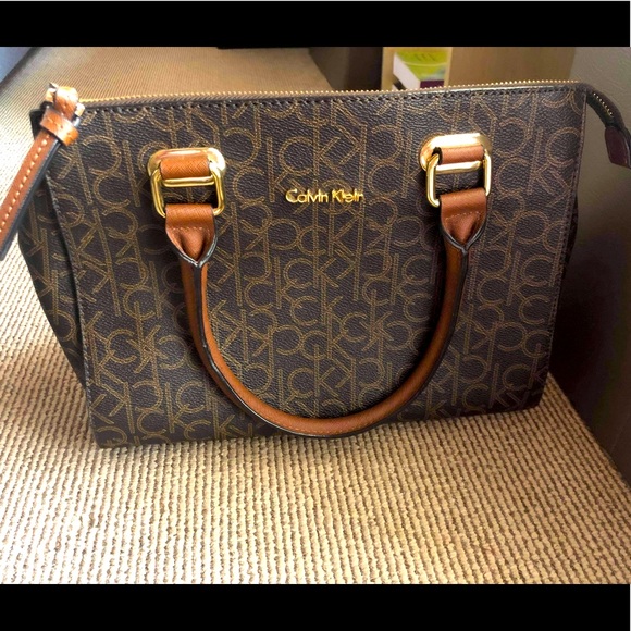 Calvin Klein Handbags - Calvin Klein leather handbag with monogram print.
